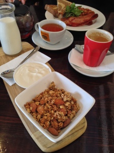 Homemade granola served with honey yogurt/plus hubby had homemade baked beans, bacon and thick rye and wheat toast. SO delicious-Wild Mulberry Cafe, Robe SA