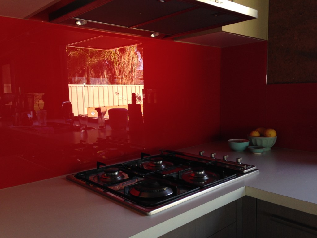 Outside reflection in red glass splash back 