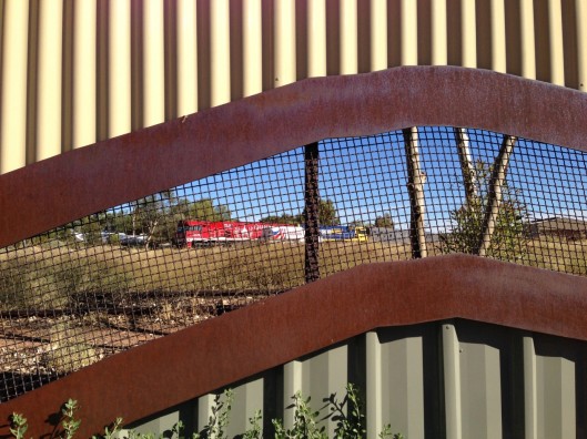 Peeking through the fence at the Ghan in Alice railyard