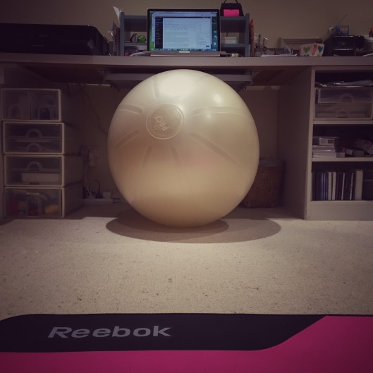Gym ball doubles as office chair, floor doubles as exercise studio